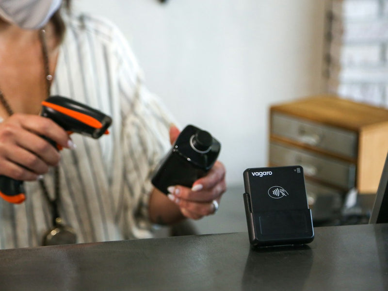 Handheld barcode scanner in use