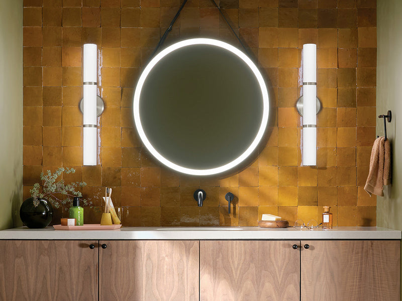 Kichler Rosh LED bath lights beside a round mirror